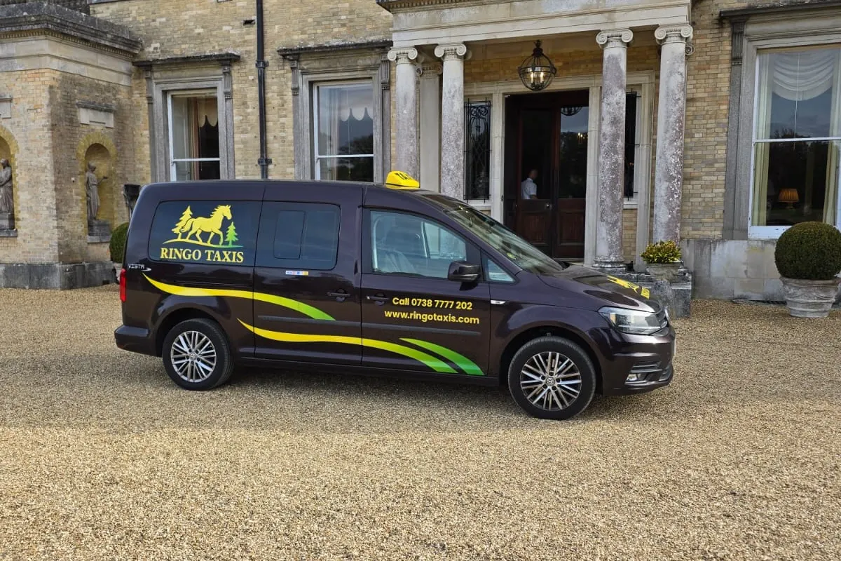 Ringo's Taxis branded wheelchair accessible taxi, side view