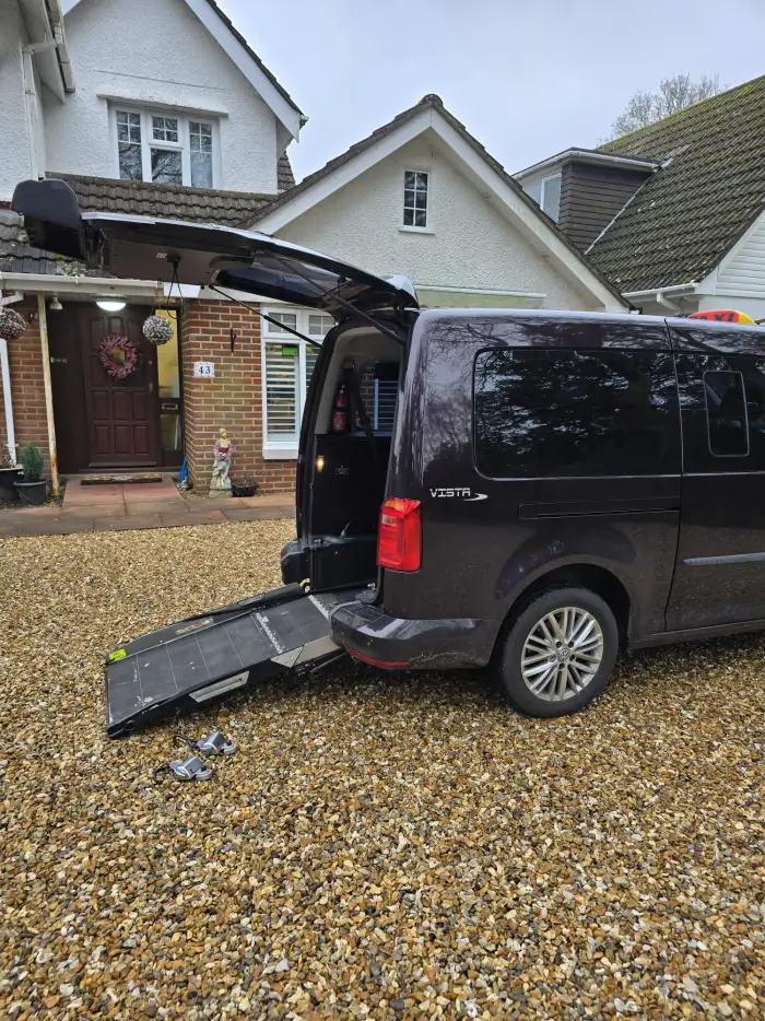 Wheelchair accessible taxi with ramp